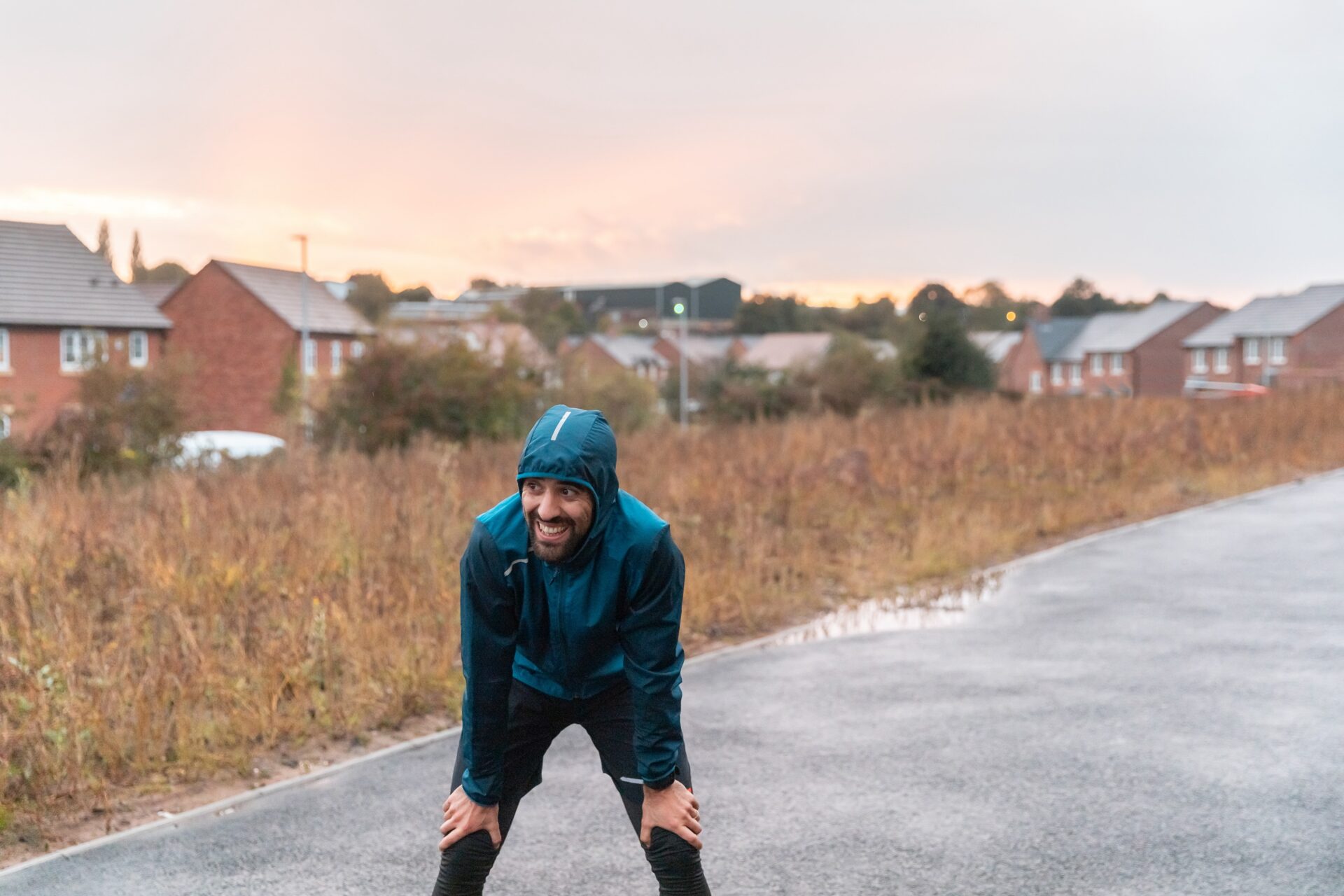 A person taking a break from exercising outside