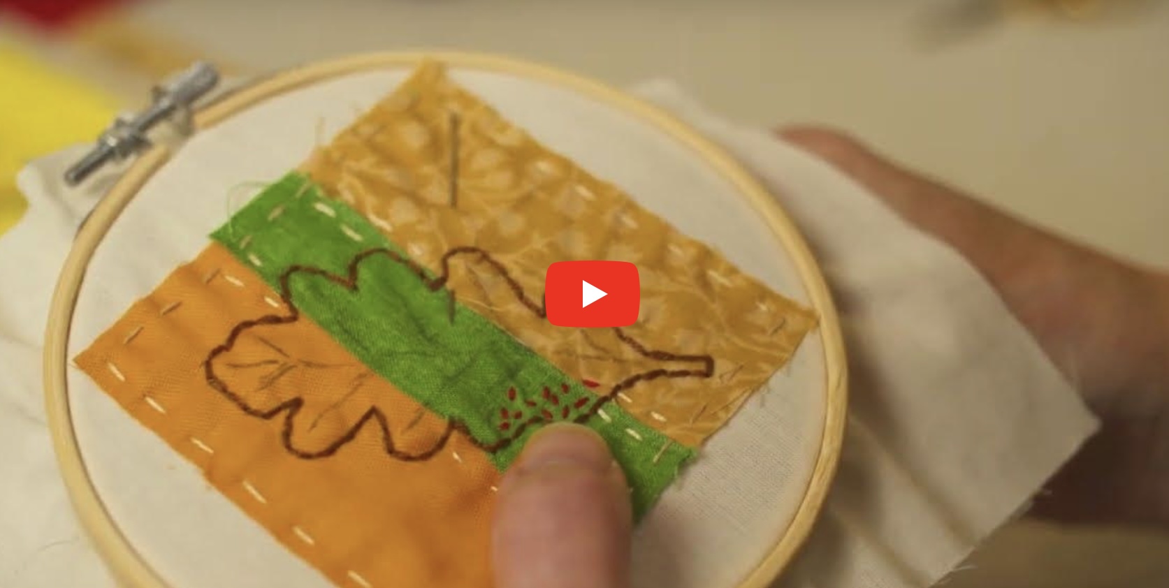 A person embroidering