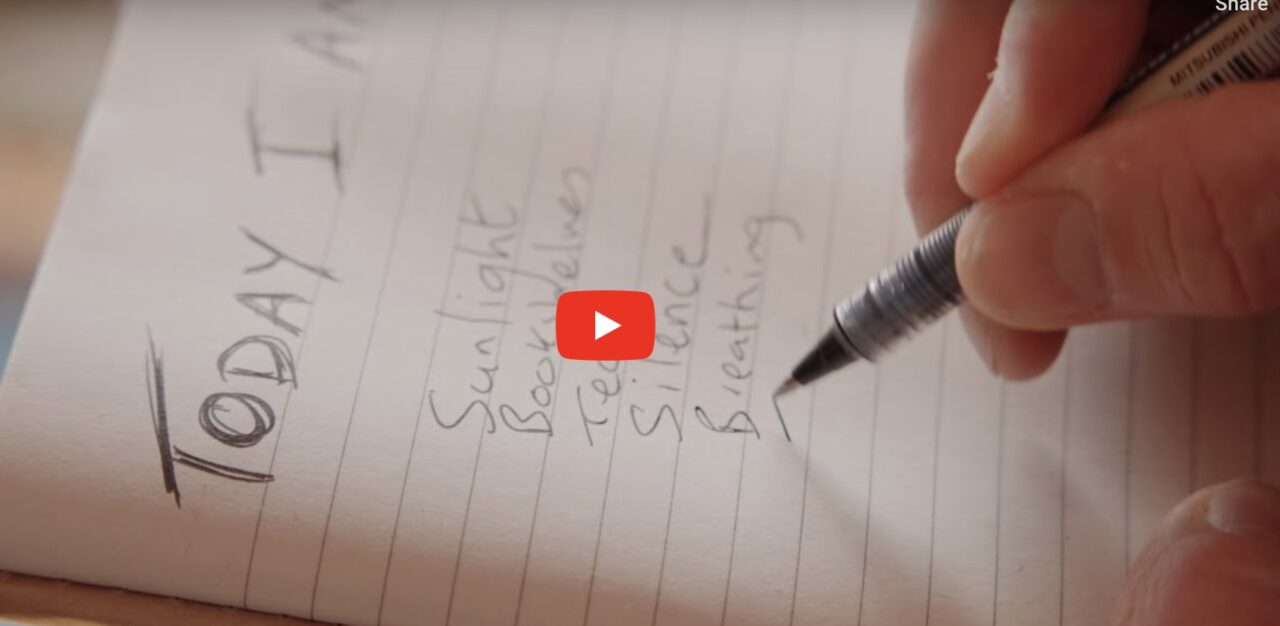 A person writing a list