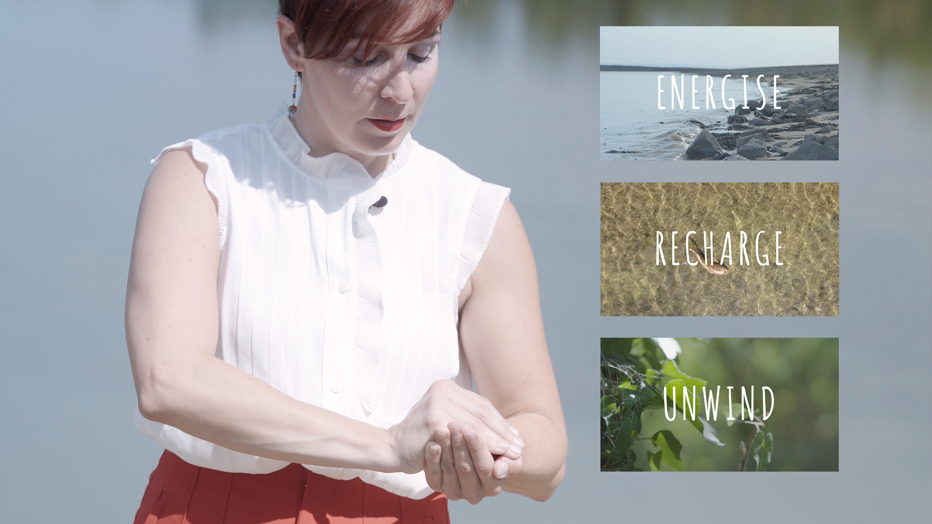 A photo of a person with short red hair cupping their hands in front of them. They're wearing a sleeveless white shirt and red trousers. Next to them are three boxes stacked on top of each other with the words 'energise', 'recharge' and 'unwind' in the centre of each box.