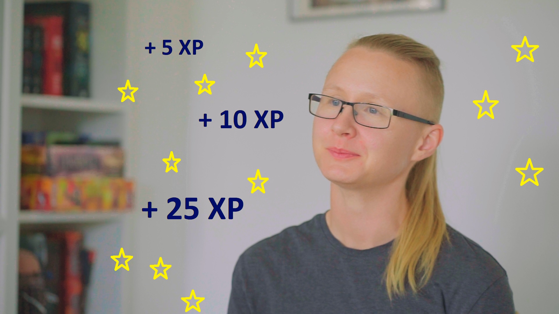 Photo of a person with a ponytail with the sides of their head shaved. They're looking off camera and wearing glasses and a grey T-shirt. Surrounding them are 11 yellow star icons and +5 XP, +10 XP and + 25 XP in navy text.