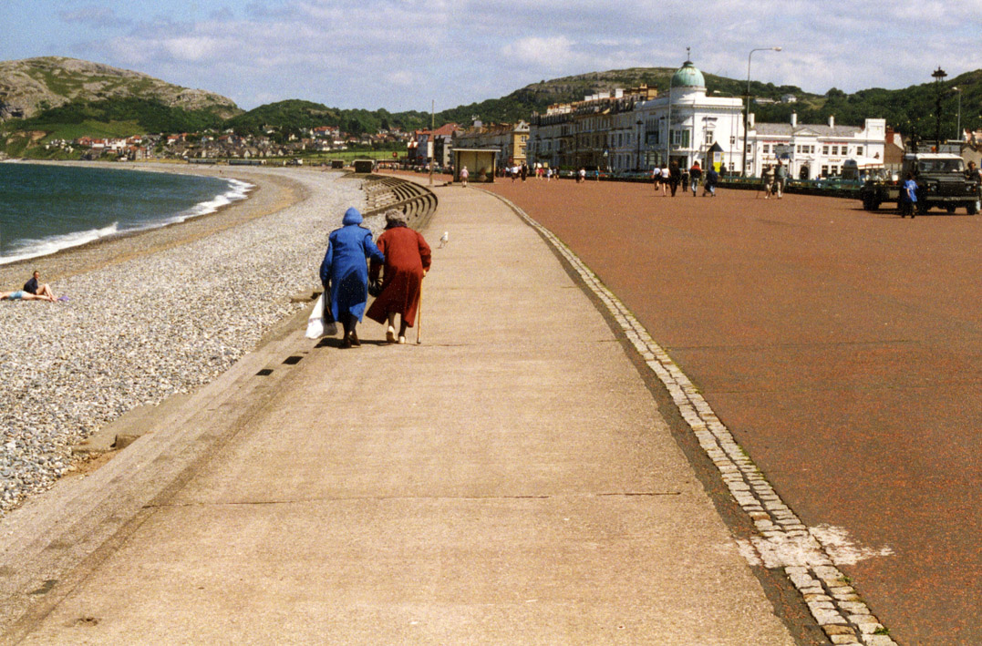 Old photo of elderly ladies walking along the promenade