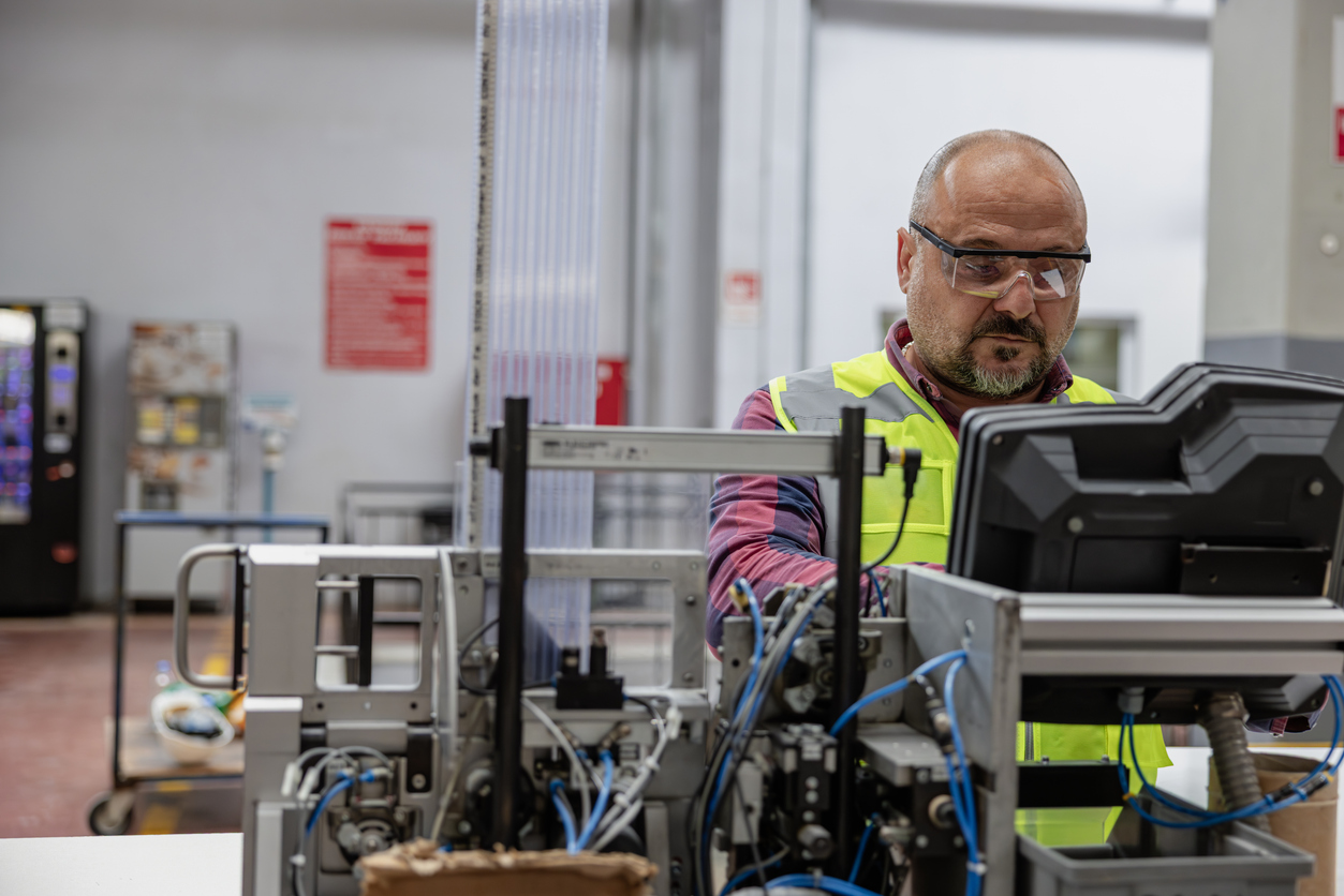 Photo of man looking thoughtful at work