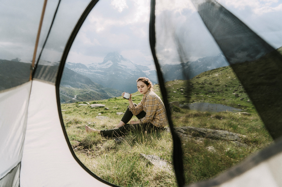 Image of young woman camping