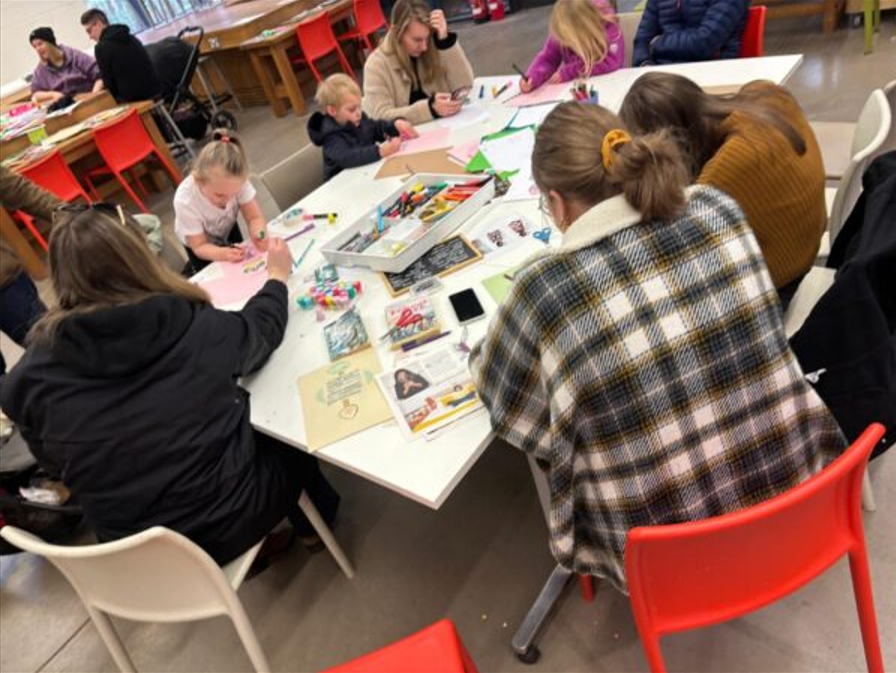 Picture of group making lovespoons